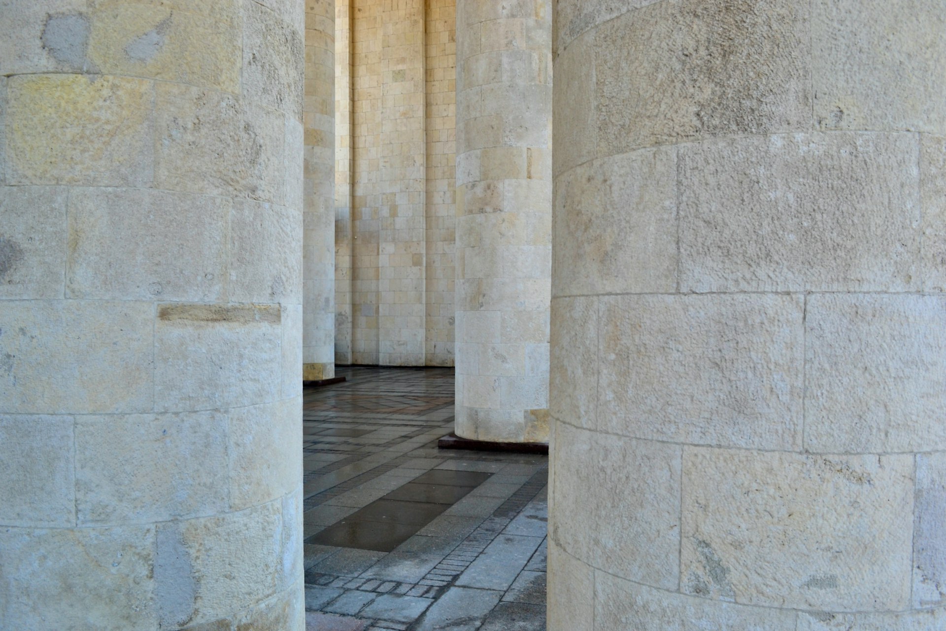 a row of stone pillars in a building
